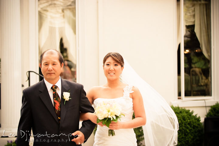 Father of the bride escorting her daughter walk down the isle. Ceresville Mansion Frederick Maryland Wedding Photo by wedding photographer Leo Dj Photography